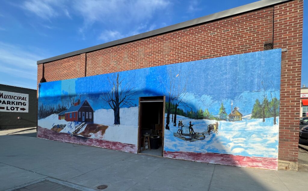 Photo of Caplan's Building with Mural
